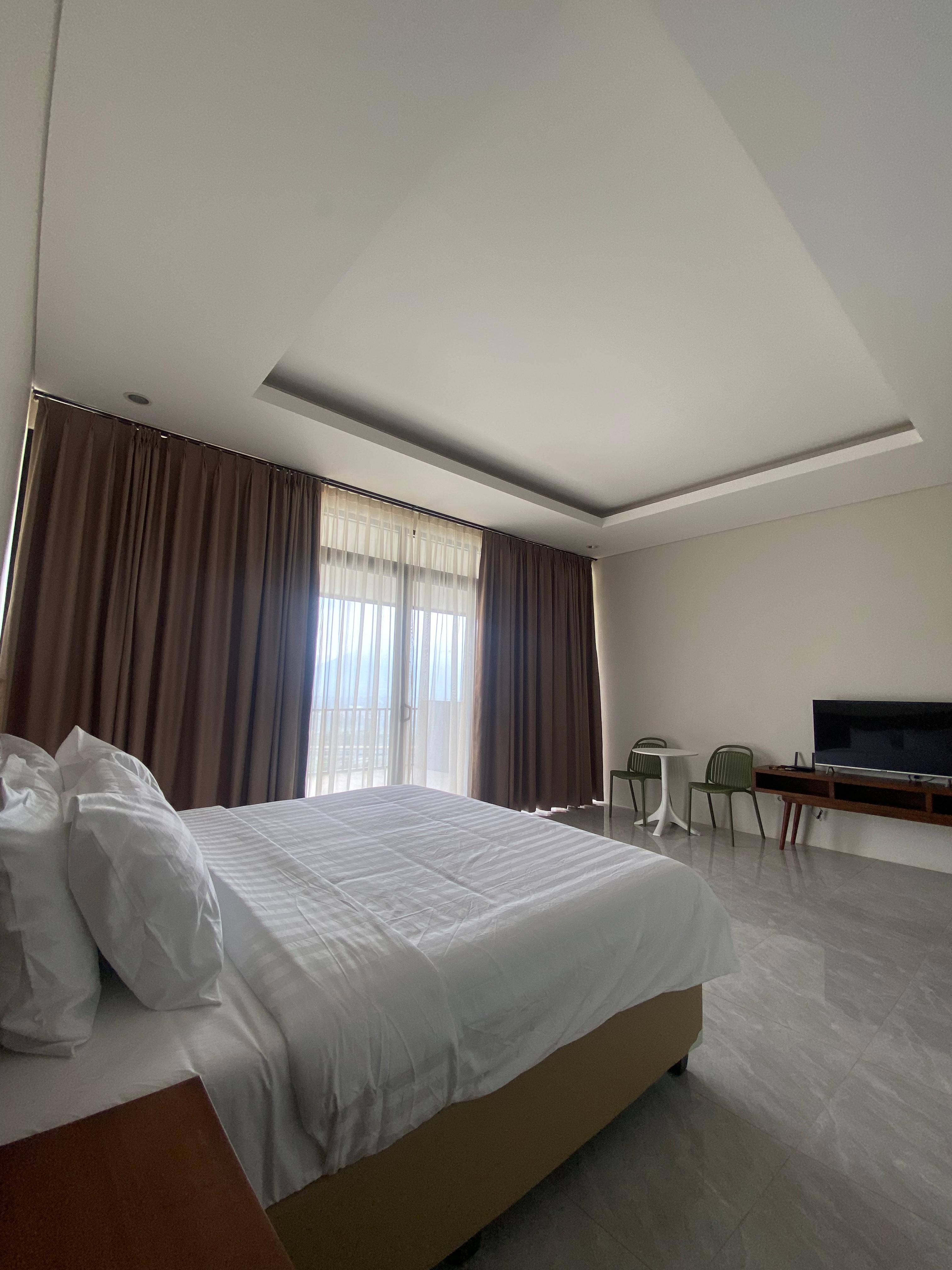 Deluxe City View bedroom with king-size bed