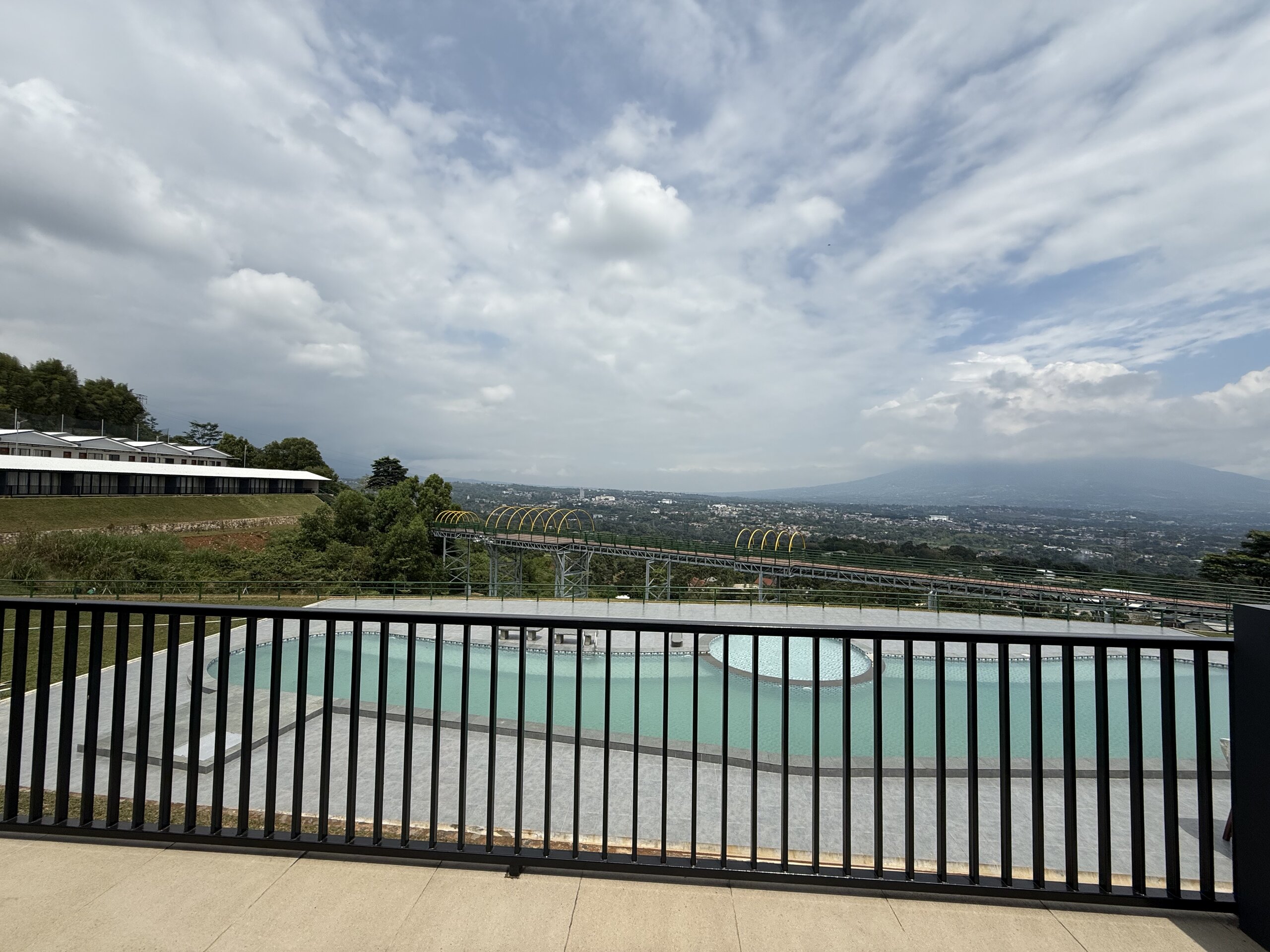 Spacious bedroom with modern decor and comfortable bedding